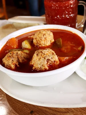 hot traditional home made albondigas also know as meatballs, served with vegetables