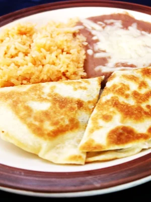 a delicious quesadilla for the small childs, served with rice and beans
