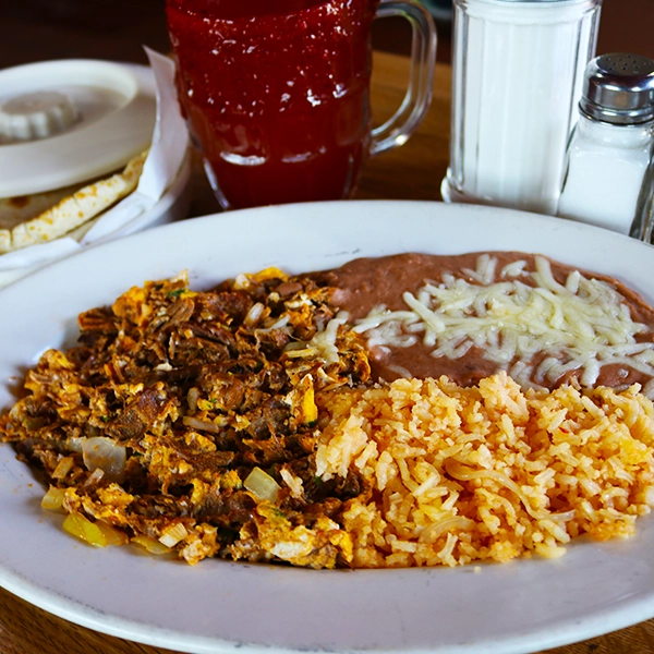 mexican style machaca and eggs served with beans and rice